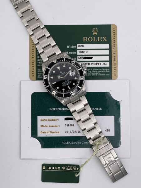 Submariner Date 16610 RRR card like new 2009 never polished